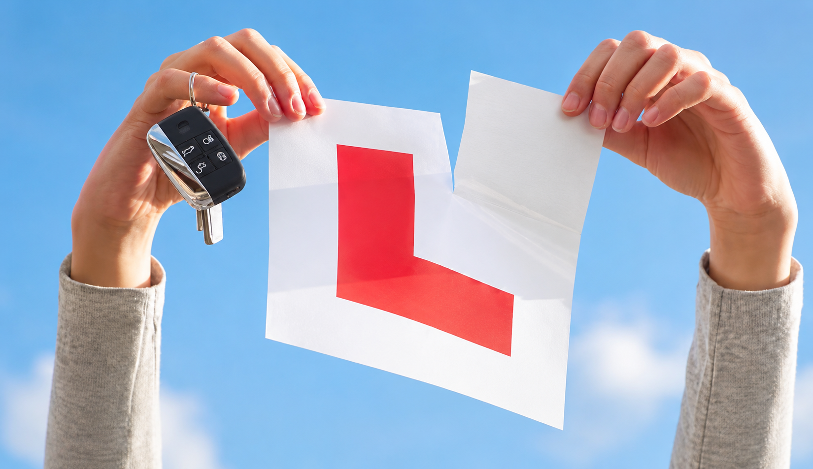 Learner ripping up their L plates after passing with AutoDrive